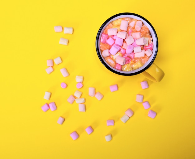 Cocoa drink in a yellow mug 