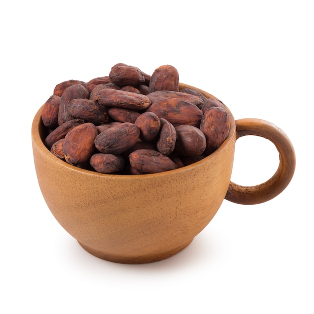 Cocoa fruit, raw cacao beans in cup isolated on a white background