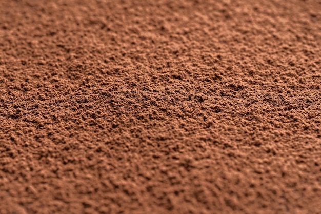 Cocoa powder background Good contrast light Shallow depth of field