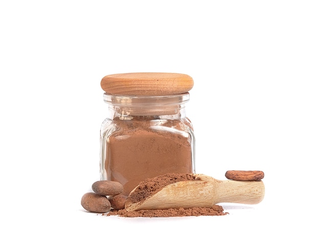 Cocoa powder in glass jar and cocoa beans