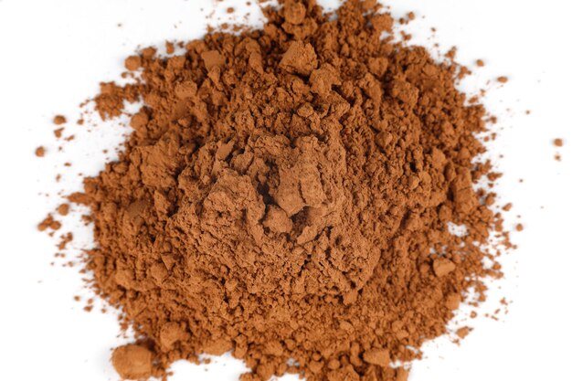 Cocoa powder heap on white isolate