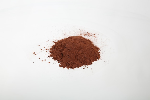 Cocoa powder isolated on white background