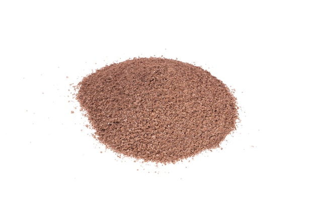 Cocoa powder sprinkled in a bunch isolated on white background. High quality photo