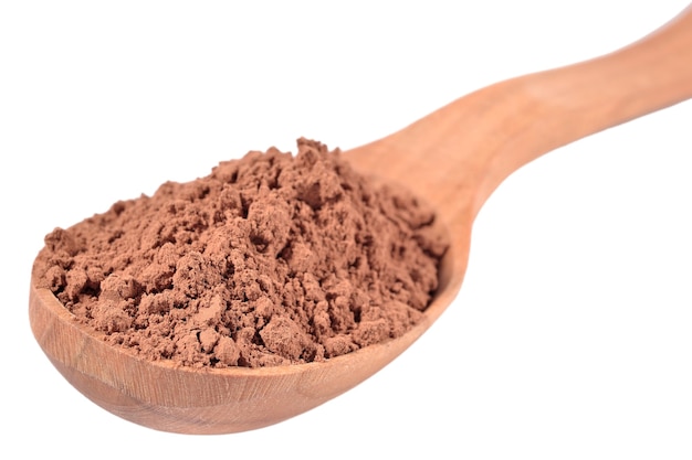 Cocoa powder in a wooden spoon on a white background