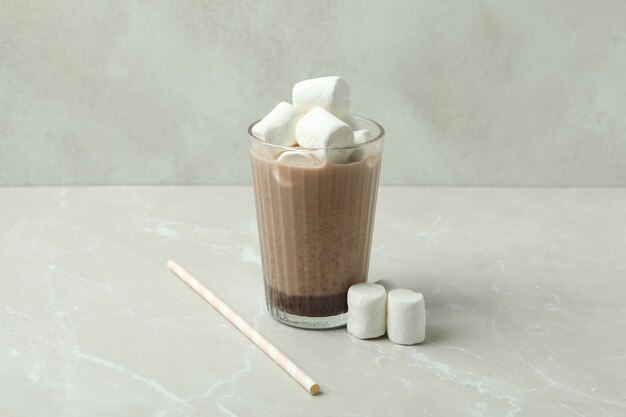 Cocoa with marshmallows in glass on light table