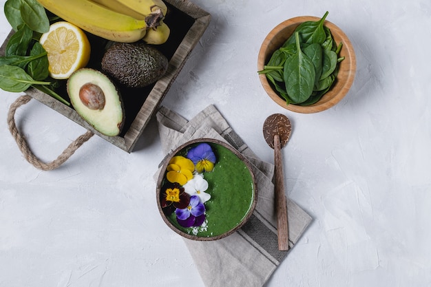 coconut bowl with green fruit smoothie