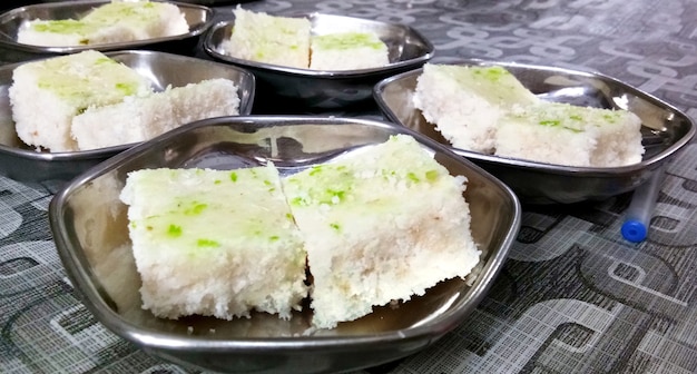 Coconut burfi or Nariyal Barfi is a sweet cake served in a plate selective focus