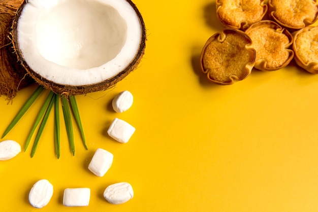 Coconut coconut candy and cocada on a yellow background