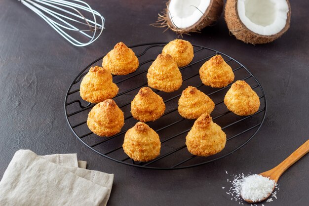 Coconut cookies on a dark surface. Baking. Vegetarian food.