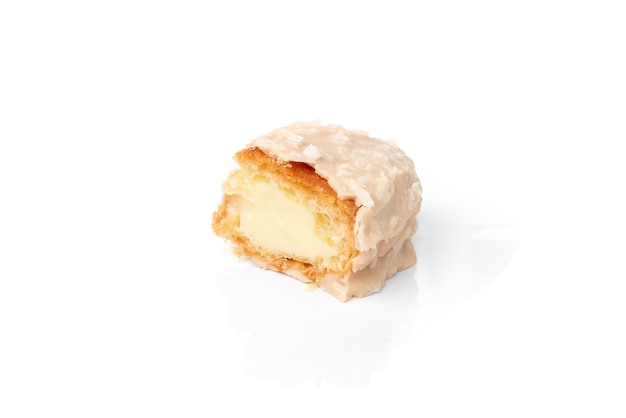 Coconut eclairs or custard cookies isolated on white.