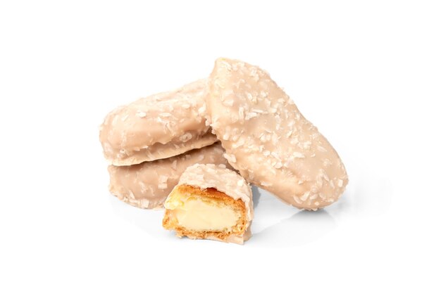 Coconut eclairs or custard cookies isolated on white.