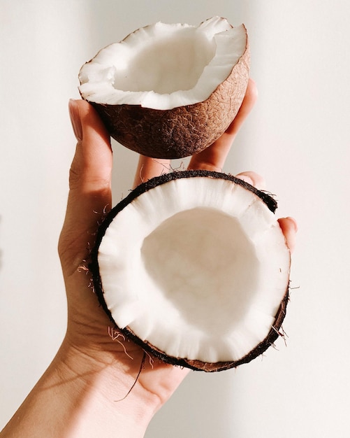 Coconut in hand Coconut milk coconut coconut flakes Fruit Photo of coconuts