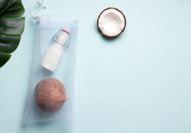 Coconut milk in a bottle and an eco bag