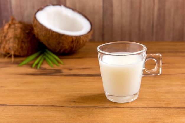 Coconut milk on wooden table