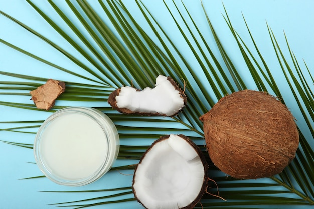 Coconut oil and coconuts on the table