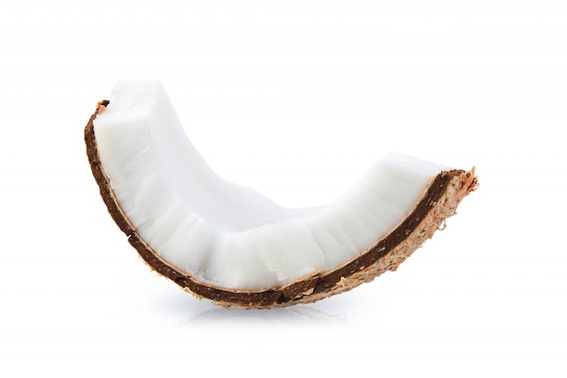 Coconut pieces isolated on a white surface.