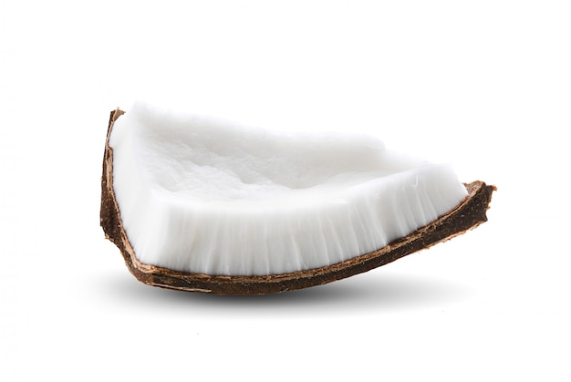 Coconut pieces isolated on a white surface.