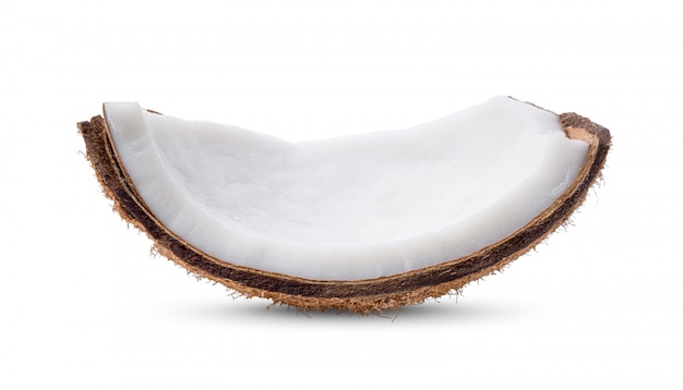 Coconut pieces on white wall. 