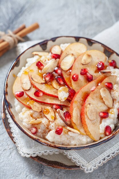 coconut rice with pomegranate, pear, cinnamon and almond slices