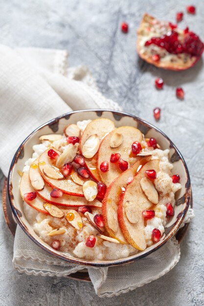 coconut rice with pomegranate, pear, cinnamon and almond slices