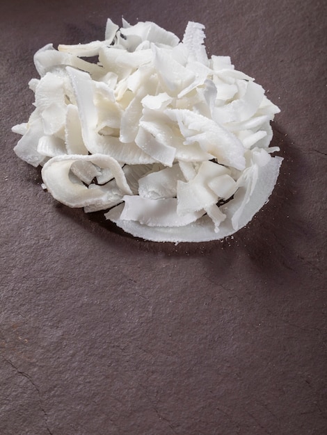 Coconut shavings on top of stone.