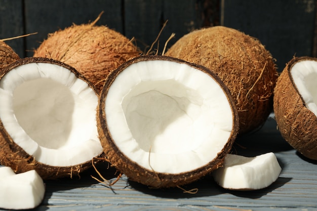 Coconut on wood, close up. Tropical fruit