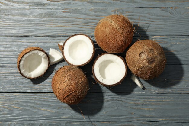 Coconut on wood, top view. Tropical fruit