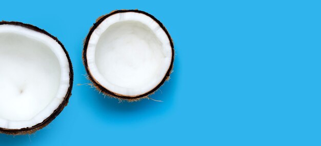 Coconuts on blue wall. Top View