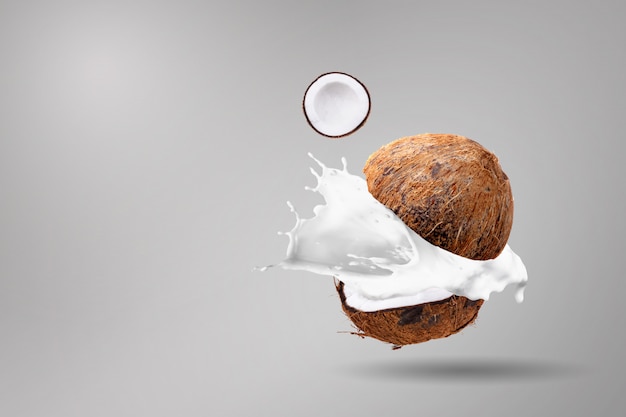 Coconuts and coconut milk splashing