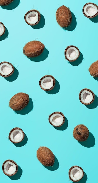 Coconuts half on blue background