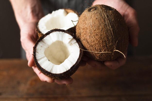 Coconuts holding in hands