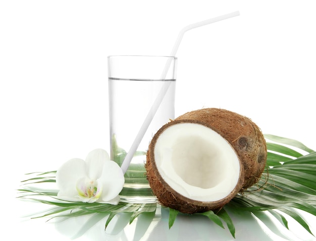 Coconuts with glass of milk isolated on white