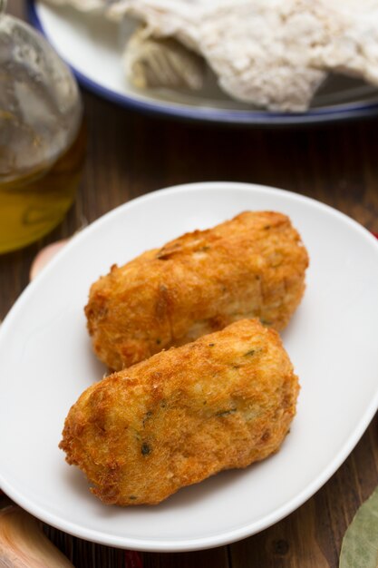 Cod fish croquete on plate