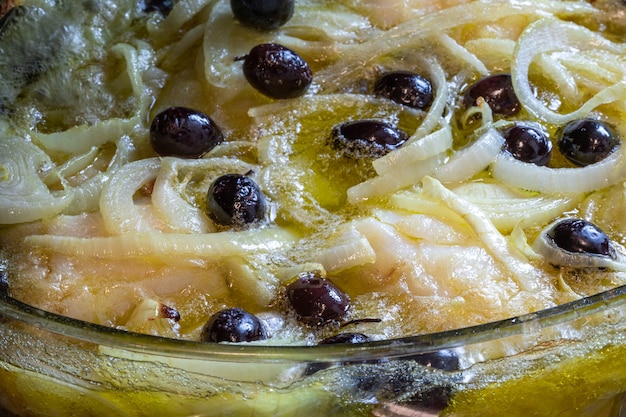 Cod loin baked in olive oil, with potatoes, broccoli, boiled egg and black olives. Typical dish of Portugal.