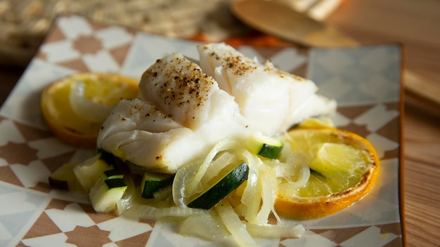 Cod loins cooked in the oven with Provencal herbs and lemon.