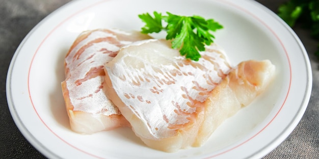 Merluzzo bianco filetto di pesce fresco pasto sano cibo spuntino dieta sul tavolo copia spazio cibo sfondo