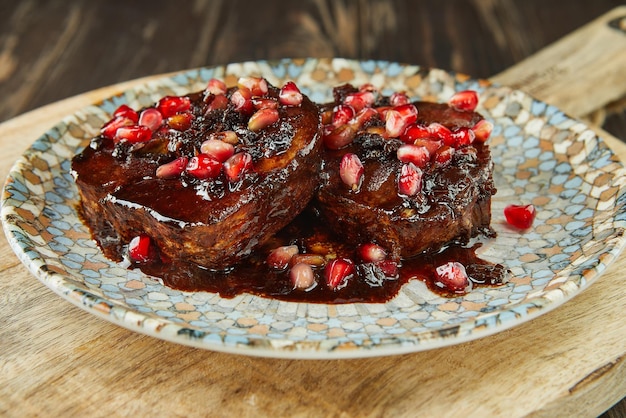 Cod with sorrel and pomegranate butter sauce. French gourmet cuisine