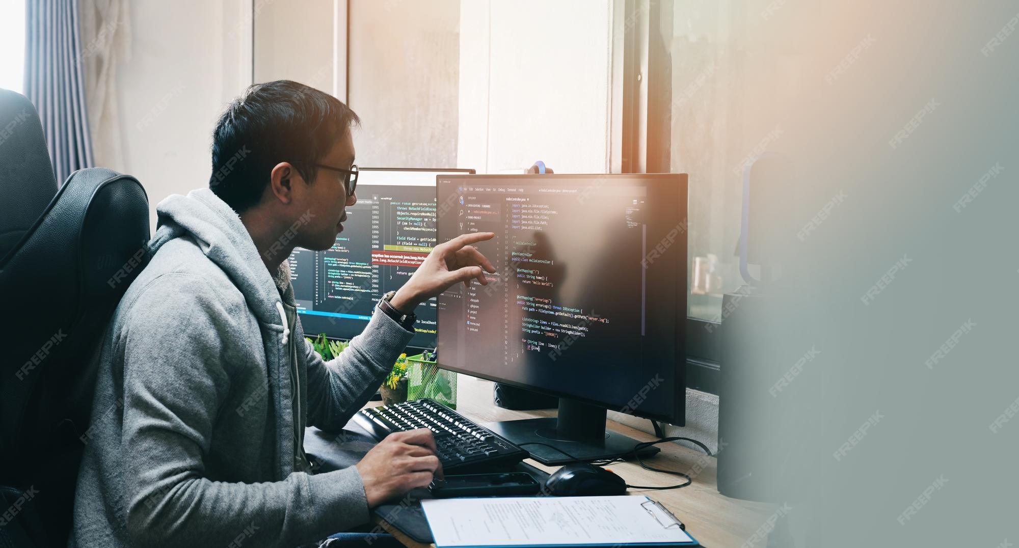 Premium Photo | Coder programmers working in office programmer analyst ...
