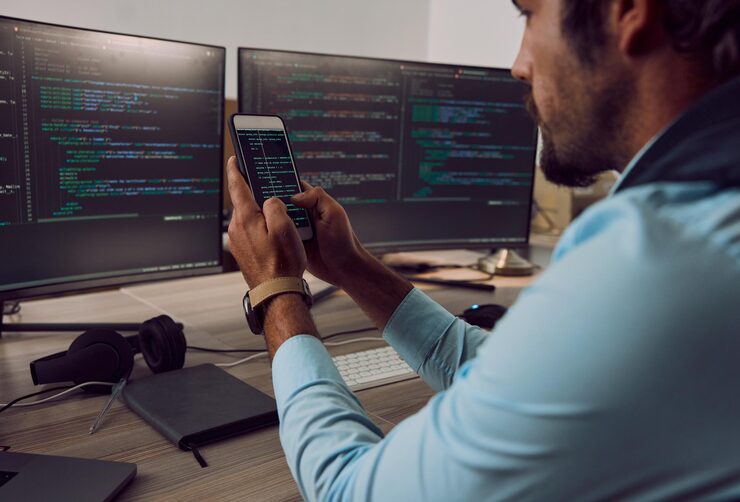 Photo coding computer screen and phone with man programmer and software update information technology and code cybersecurity ux and network with wifi web design and cyber space with cpu programming