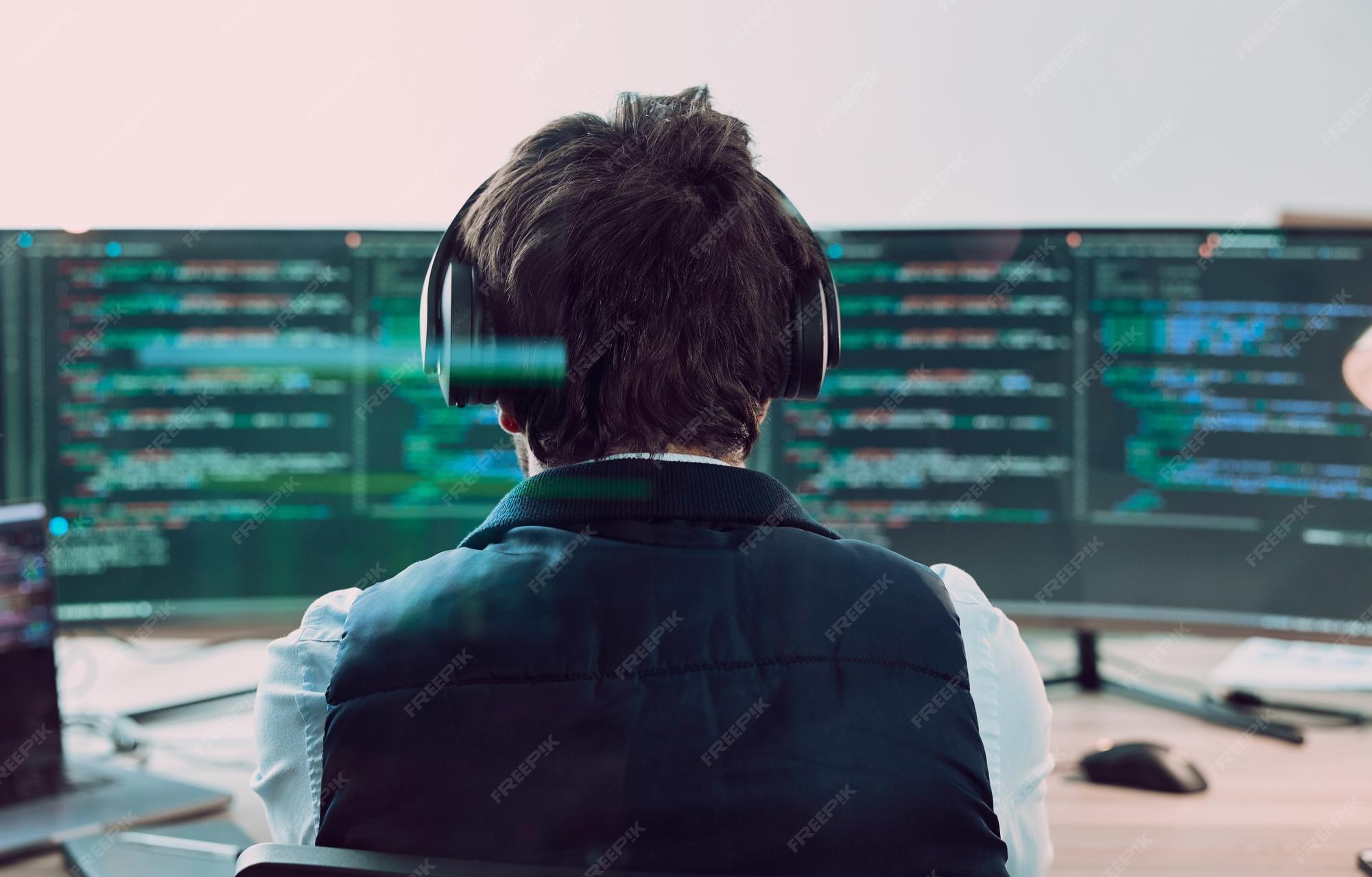 Premium Photo | Coding computer screen with man programmer and web ...