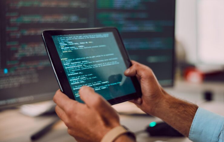 Photo coding tablet in hands with man web design and software update computer with information technology and code cybersecurity ux and network with wifi programmer and cyber space with programming
