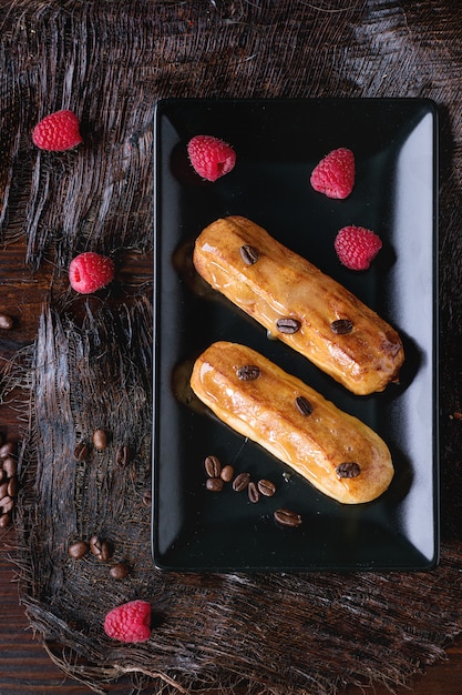 Coffe eclair with raspberries