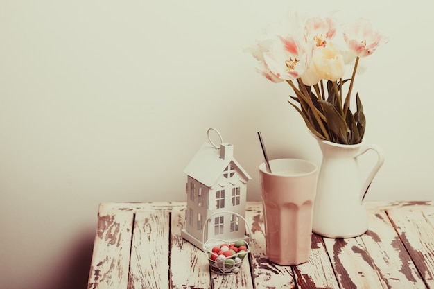 Coffe Latte and tulips on the shabby chic table