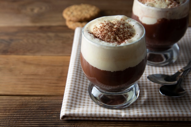 Coffee affogato with vanilla ice cream and espresso. Glass with coffee drink and icecream.