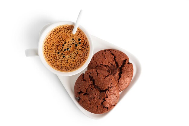 Coffee americano in cup and saucer isolated on a white background. Hot coffee with foam. Coffee with chocolate cookie. High quality photo