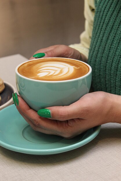 coffee art in beautiful woman hands