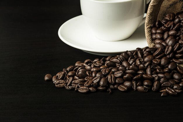 Coffee bean on black wood background