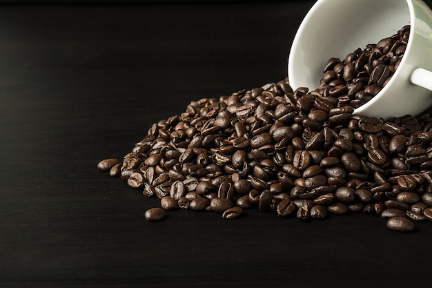 Coffee bean on black wood background