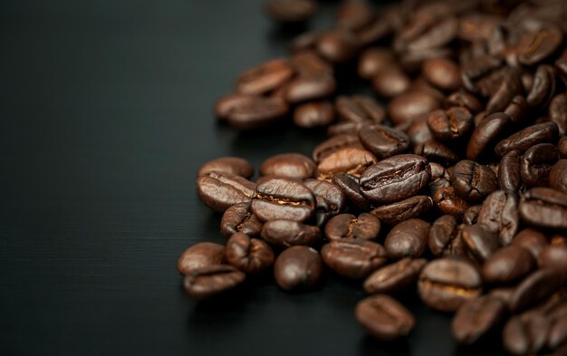 coffee bean on black wood background