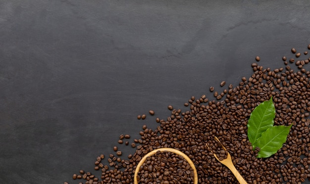 Coffee bean on black wooden floor background